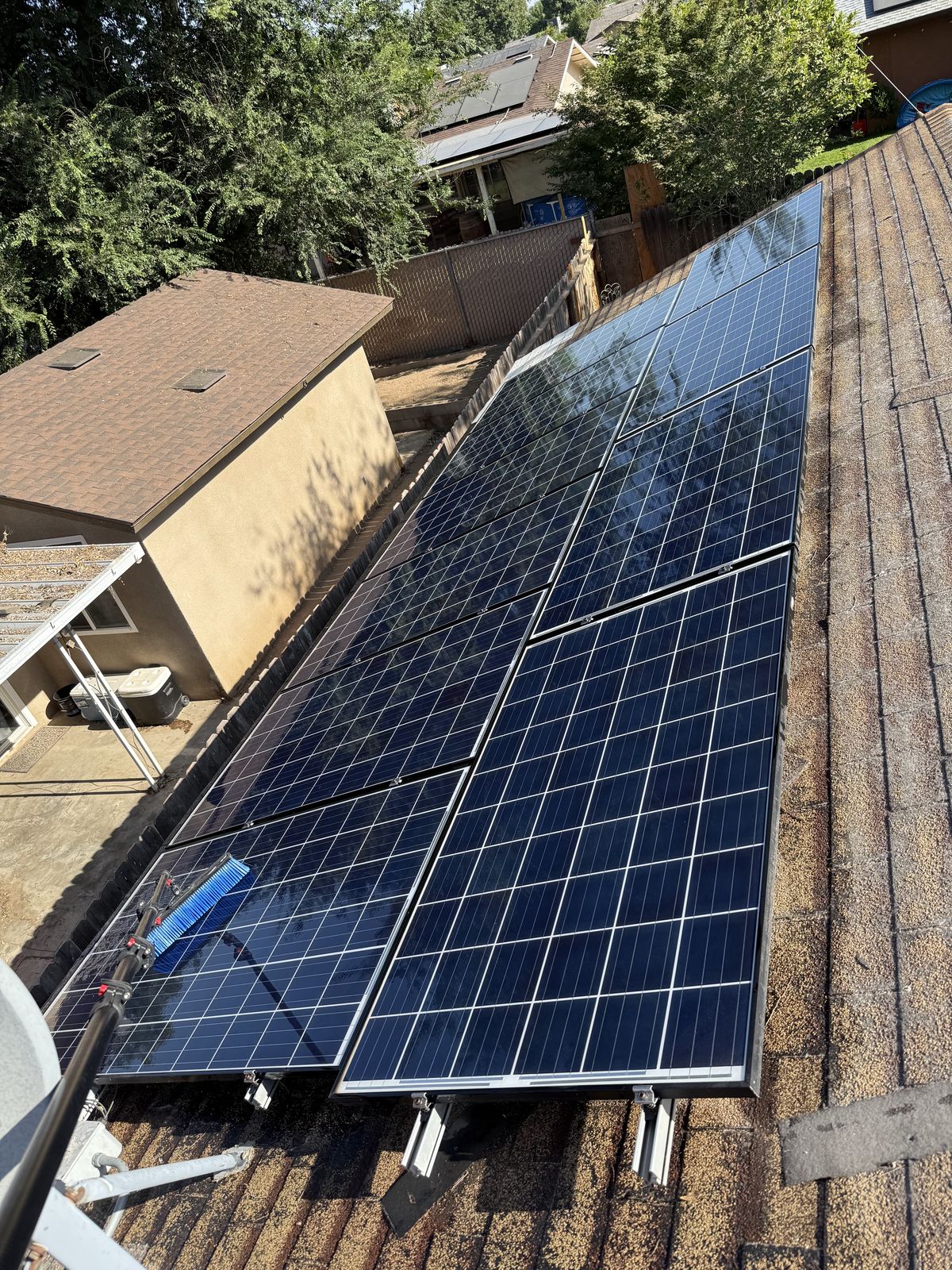 Freshly cleaned solar panels gleaming after an RO/DI purified-water wash